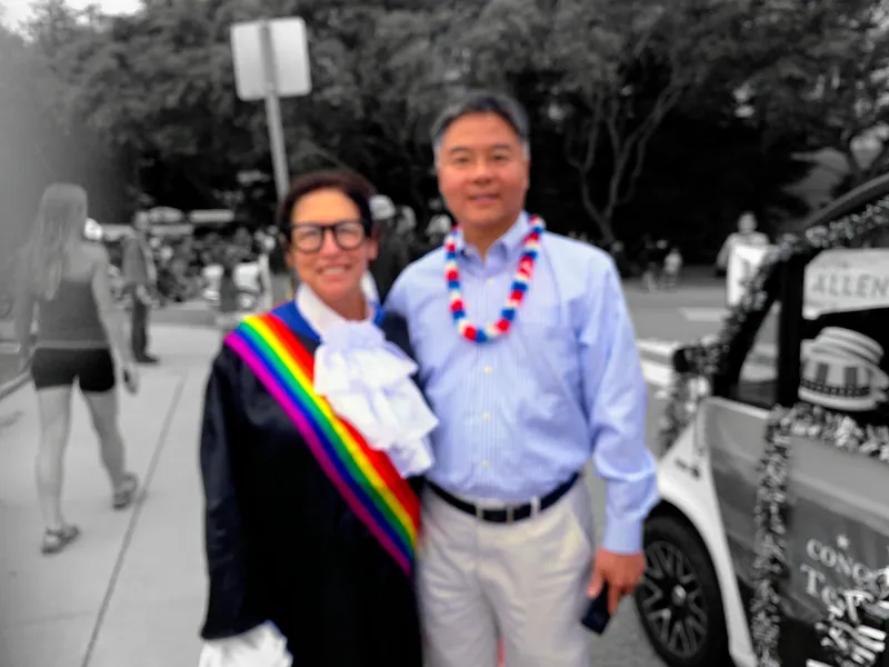 Sue Himmelrich in a judicial robe standing with Representative Ted Lieu.
